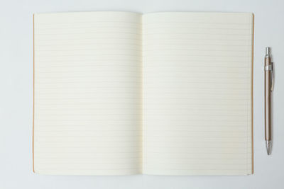 Close-up of open book against white background