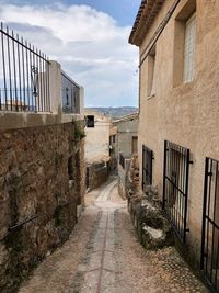 Footpath/ alley amidst buildings in the city of letur, spain