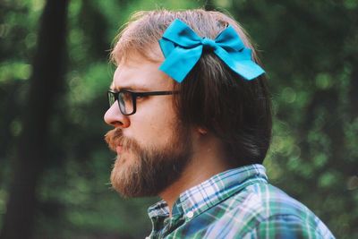 Side view of man wearing eyeglasses