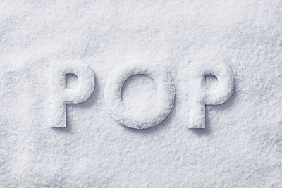 Close-up of text on snow