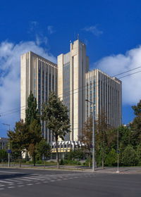 Modern buildings against sky in city