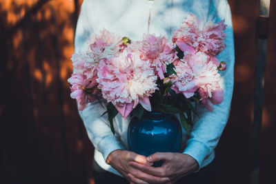 Close-up of hand holding bouquet