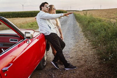 Rear view of couple on road