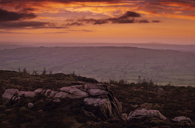 Scenic view of landscape against sky during sunset