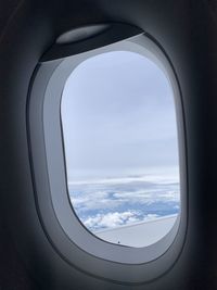 Aerial view of sky seen through airplane window
