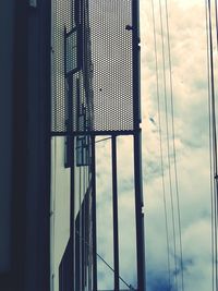 Low angle view of metal structure against sky