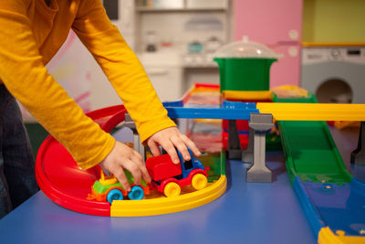 Midsection of man holding toy