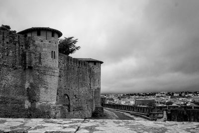 Old building against cloudy sky