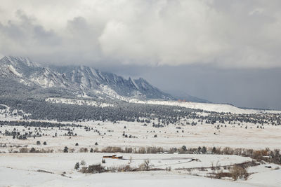 Flatirons in snow outside boulder, colorado