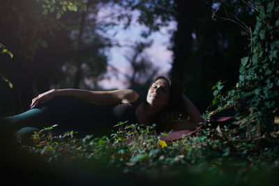 Woman lying down on land