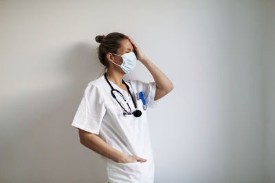 Female doctor wearing protective face mask