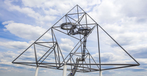 Low angle view of metallic structure against sky