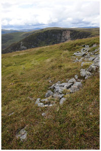 Scenic view of landscape and mountains against sky
