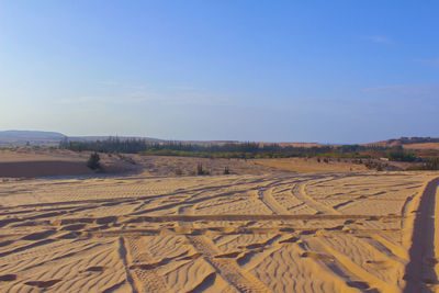 Scenic view of arid landscape against sky