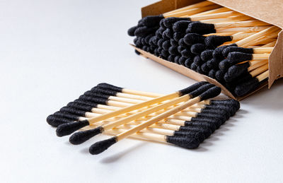 Close-up of matchsticks on white background