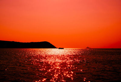 Scenic view of sea at sunset