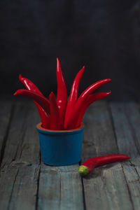 Close-up of red chili peppers on table