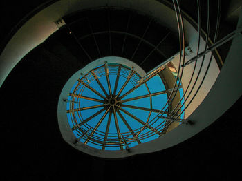 Low angle view of illuminated skylight in building