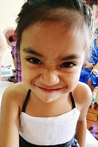 Close-up portrait of smiling girl