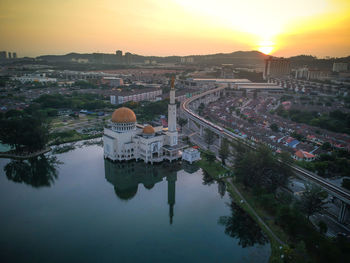 High angle view of buildings against sky during sunset