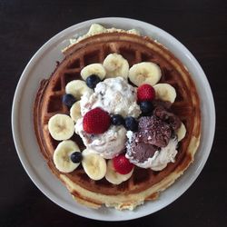 Berries and ice cream on waffle