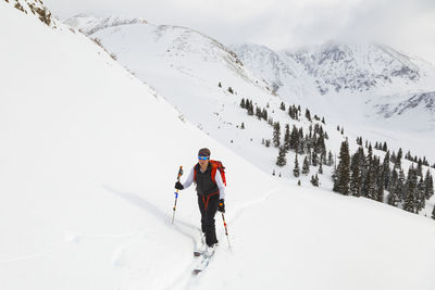 Woman on backcountry ski tour, mayflower gulch, colorado