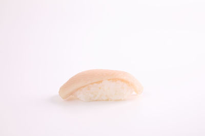 Close-up of bread against white background