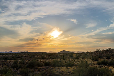 Scenic view of landscape against sky during sunset