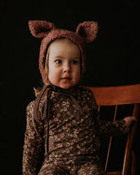 Toddler baby girl in funny hat with ears having fun