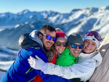 Portrait of people on snow covered mountain