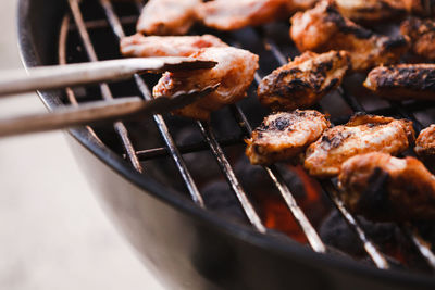 High angle view of meat on barbecue grill