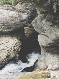View of river flowing through rock