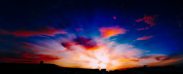 Low angle view of dramatic sky at sunset