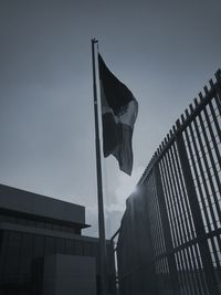 Low angle view of flag against sky