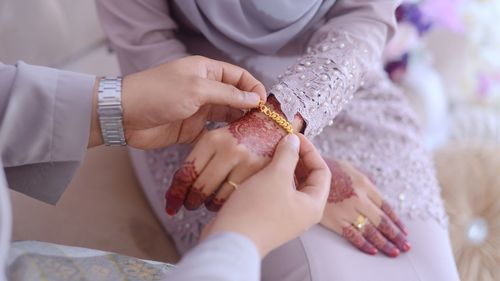 Close-up of woman holding hands