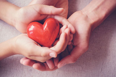 Close-up of hands holding heart shape