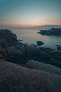 Scenic view of sea at sunset