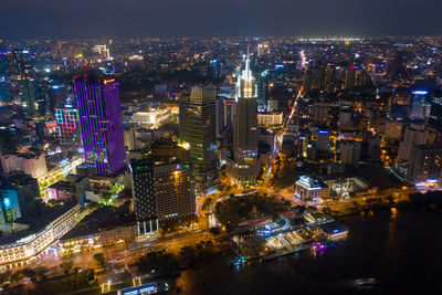 High angle view of illuminated buildings in city at night