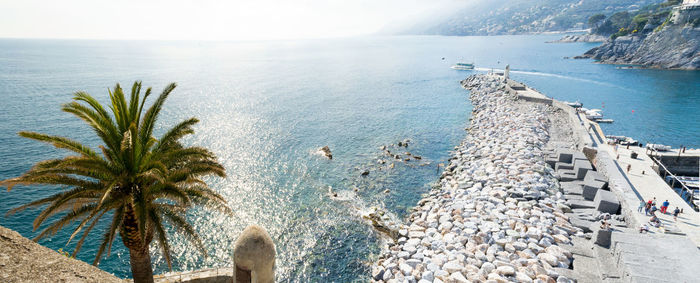 Pier of the touristic harbor of the village of camogli, liguria, italy that faces paradise bay