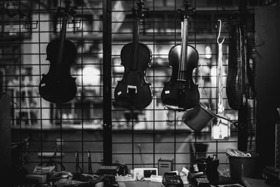 Violins hanging at workshop