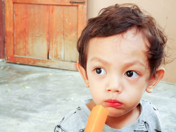 Close-up of cute boy eating food