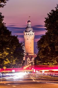 Illuminated building against sky at night