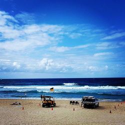 Scenic view of sea against cloudy sky