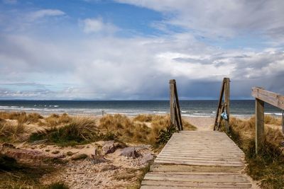 Scenic view of beach against sky