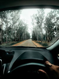 Road seen through car windshield