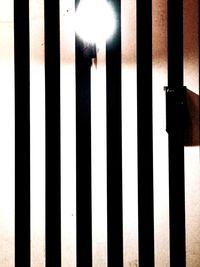 Close-up of metal fence against wall