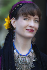 Close-up portrait of smiling young woman