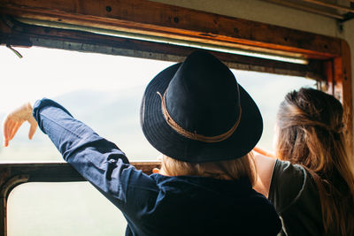 Rear view of couple in train