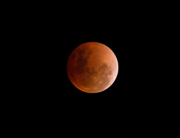 Low angle view of moon against clear sky at night