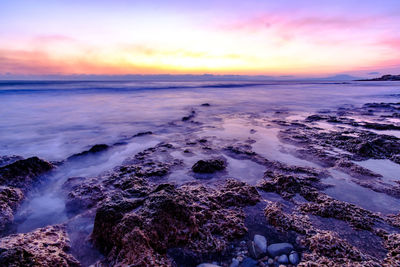 Scenic view of sea against sky during sunset